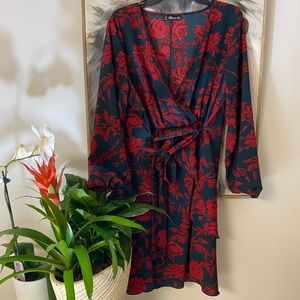 Wrap styled floral dress. Navy with red detail